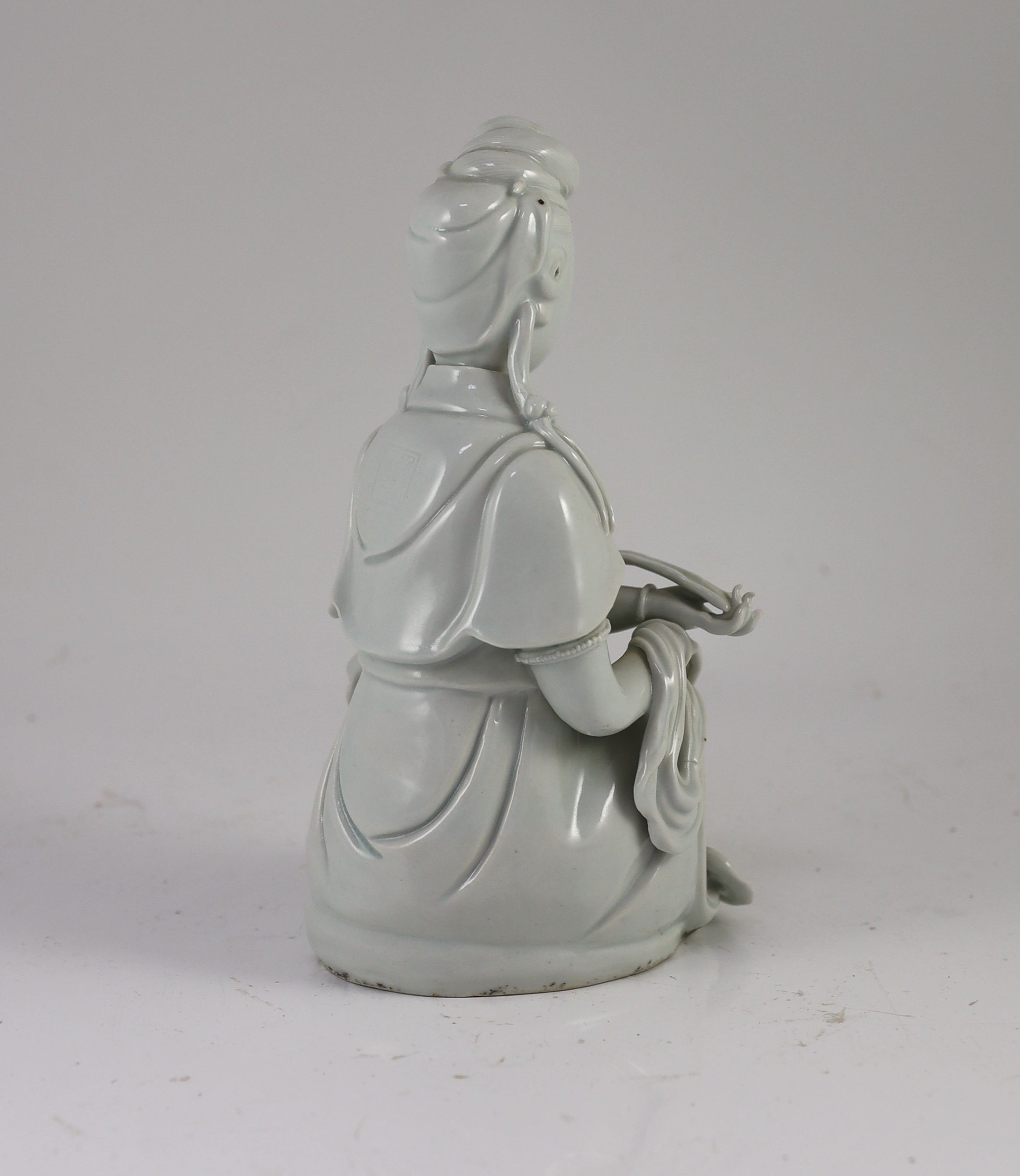 A Chinese blanc-de-chine seated figure of Guanyin, Dehua kilns, 19th/20th century, 23cm high